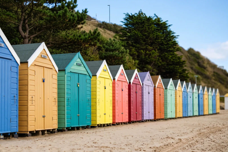 Colourful beach huts under the pines on the Bournemouth seafront