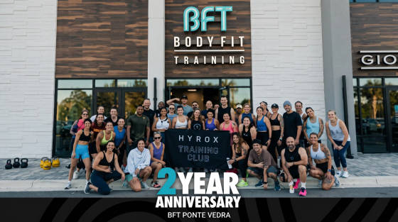 Group of fitness enthusiasts posing outside BFT BodyFit Training