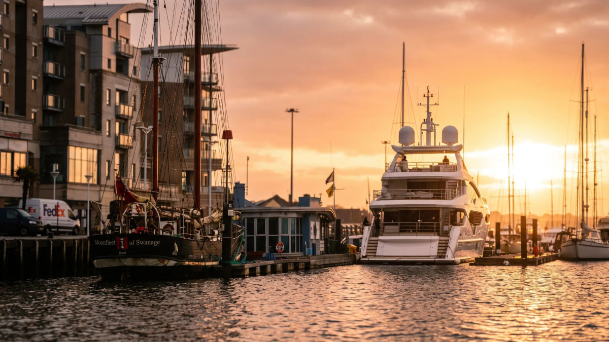 Yachts moored at Poole Quay at sunset