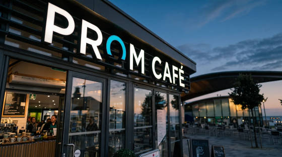 Prom Café sign and entrance with outdoor seating area