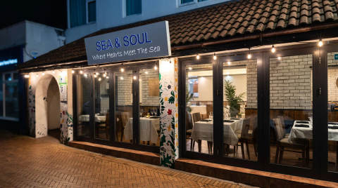 Exterior view of Sea & Soul restaurant with outdoor seating