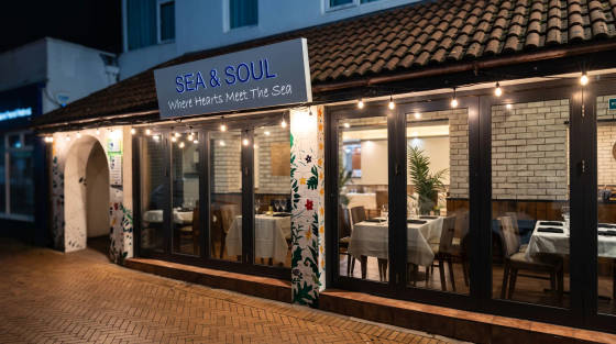 Exterior view of Sea & Soul restaurant with outdoor seating