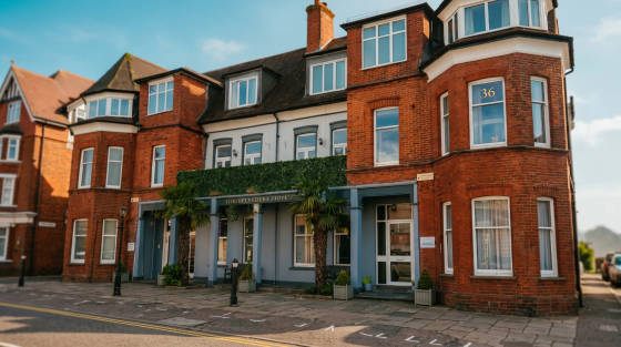 Red brick building with a sign for The Belvedere Hotel