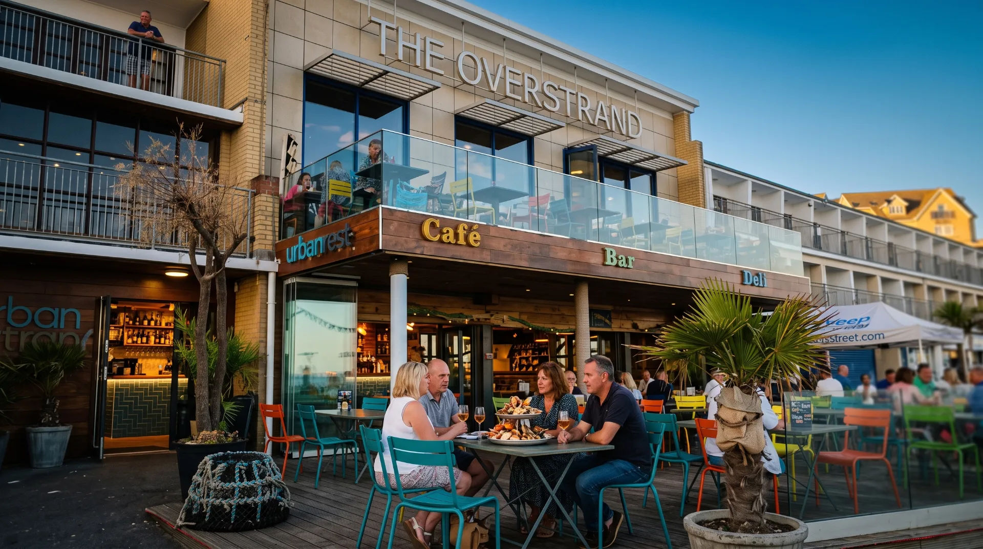 Outdoor dining at The Overstrand with people enjoying food and drinks on a sunny day.
