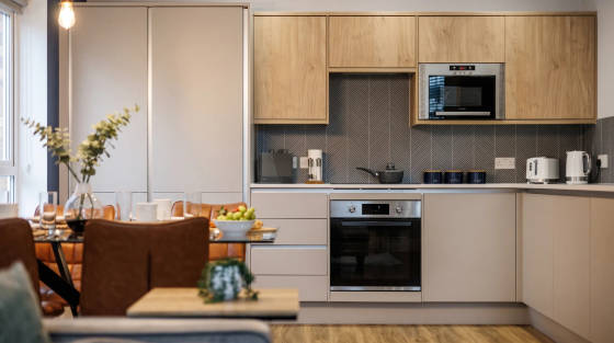 Contemporary kitchen with wooden cabinets and dining table