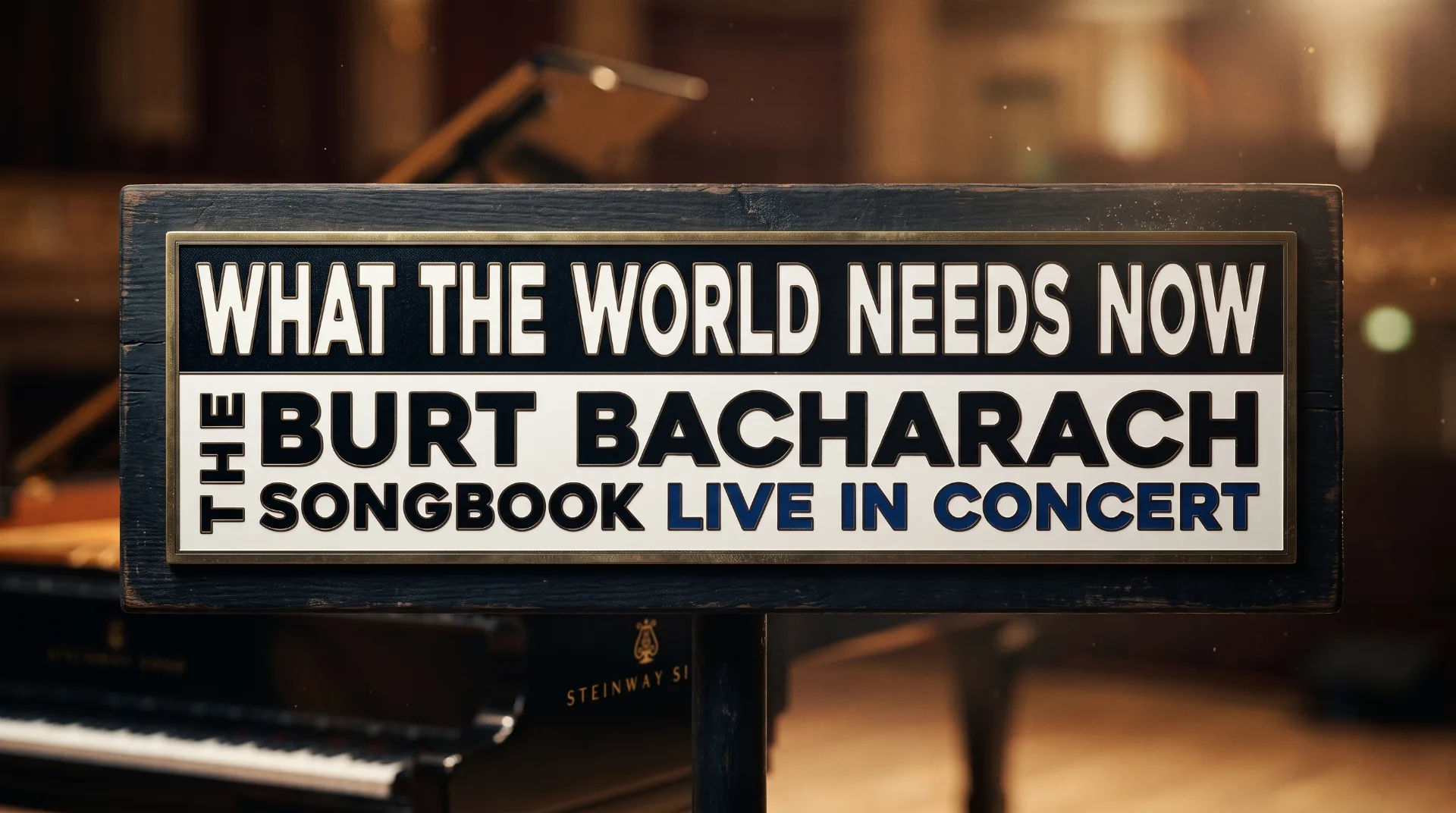 Sign announcing Burt Bacharach concert with the title 'What the World Needs Now' and details of the songbook performance
