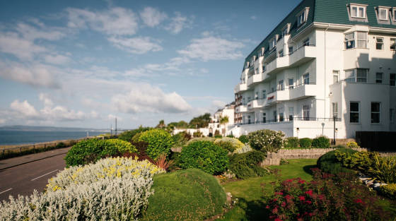 White hotel building with gardens and sea view in Bournemouth