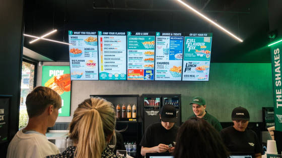 Digital menu board showing food options at a Bournemouth eatery