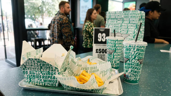 Tray with fries and drinks at a fast food counter