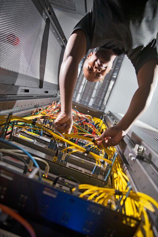 VBTRONICS Technician Working on Control Panel