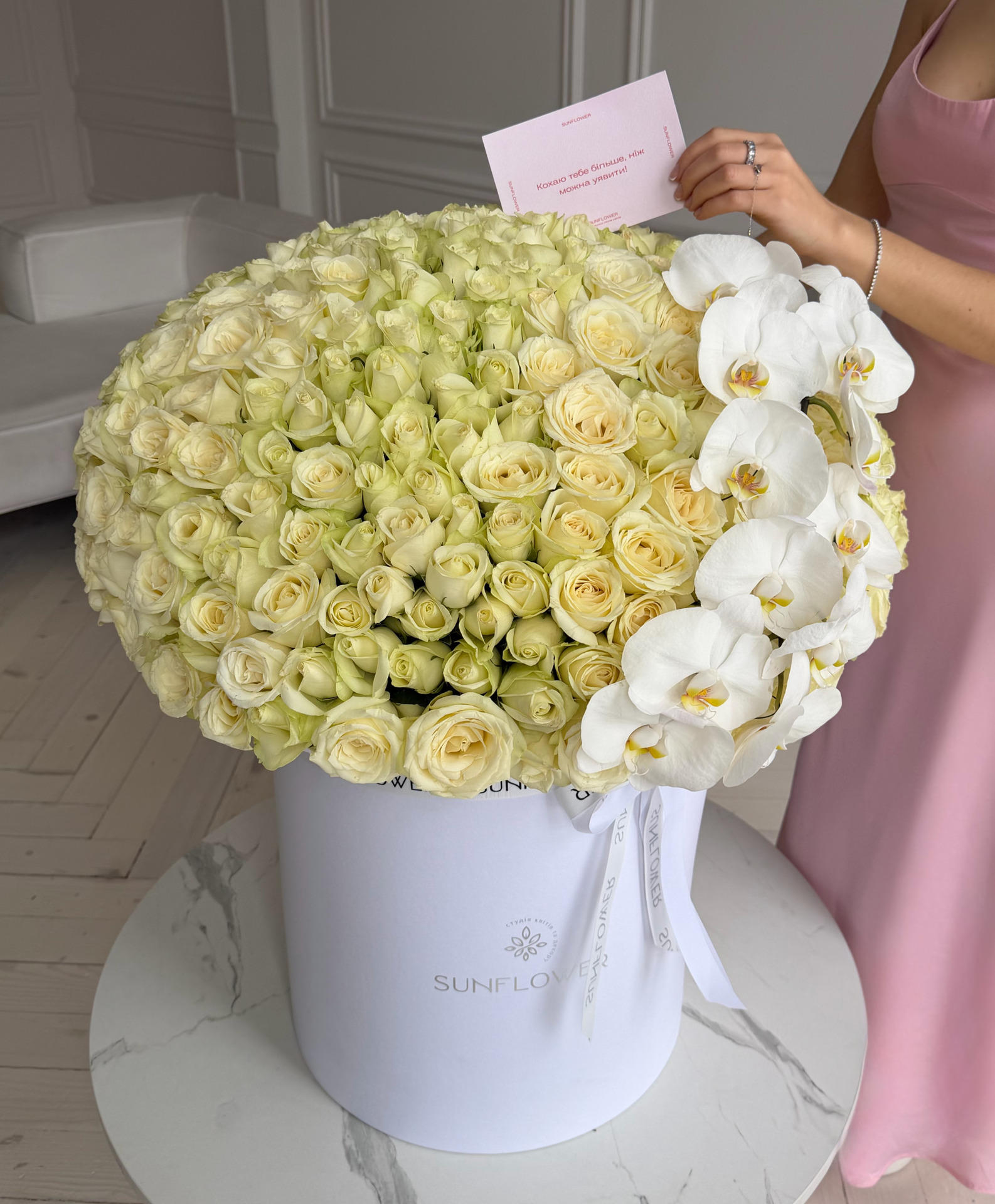 Box of Snowstorm roses and orchid