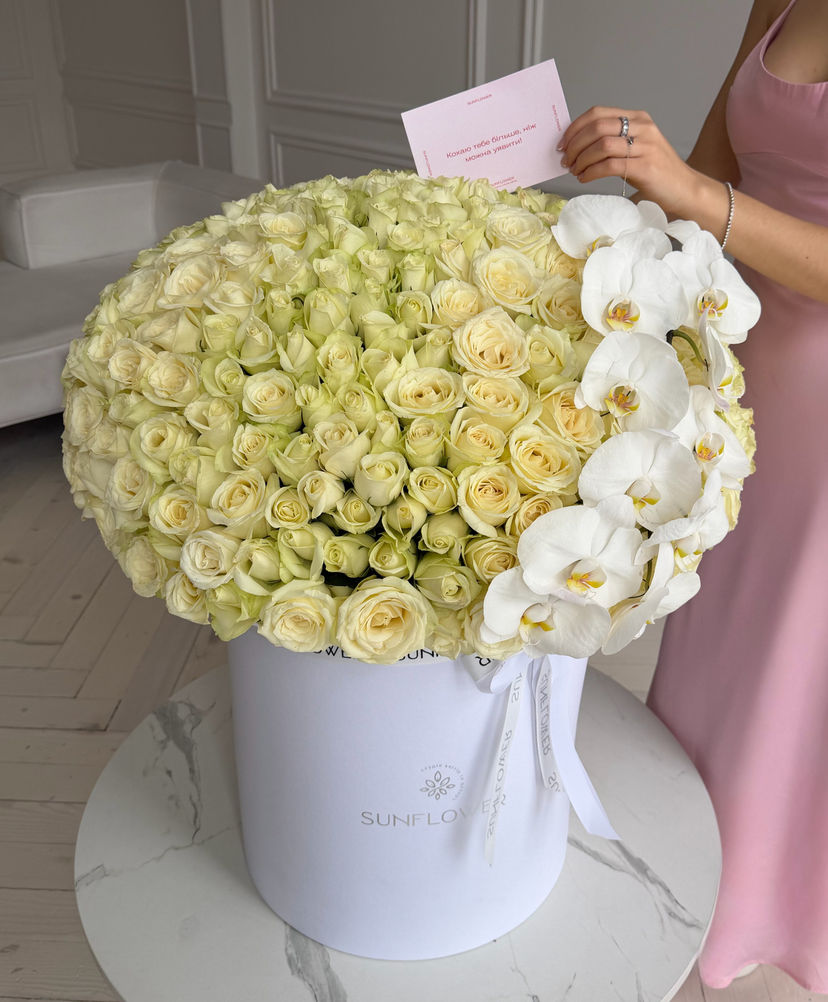 Box of Snowstorm roses and orchid