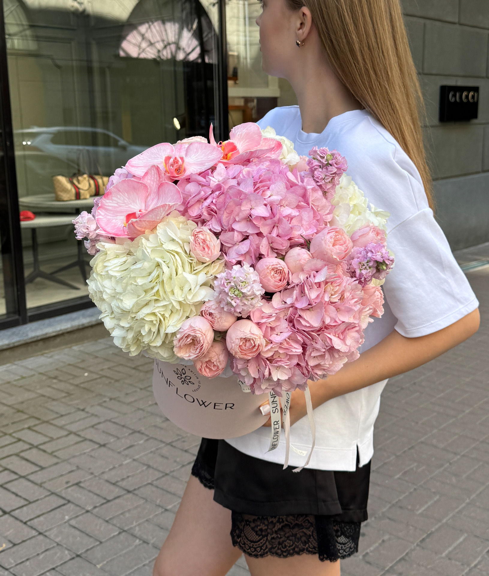 A composite composition of hydrangeas, roses and orchids