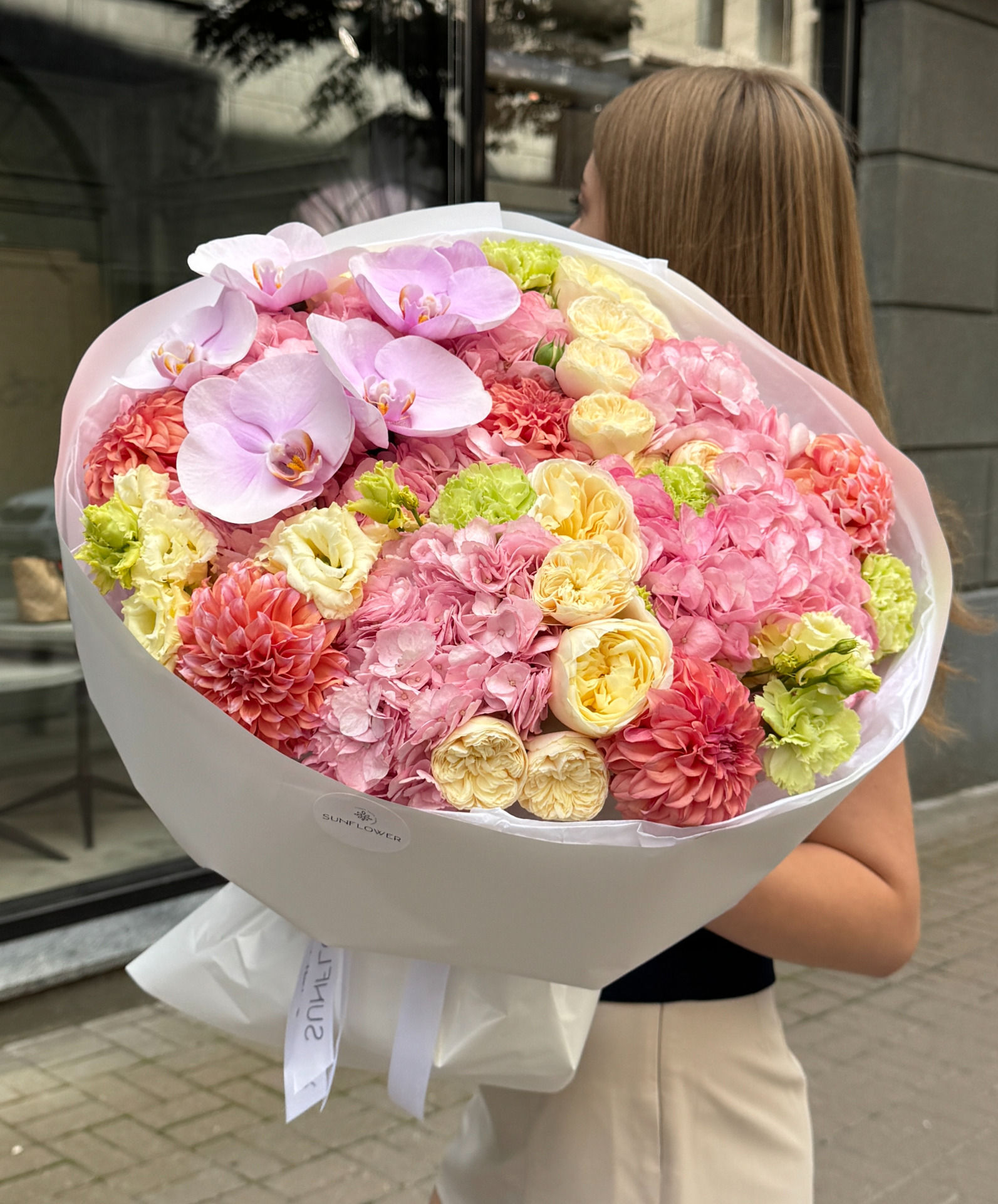 A lush bouquet in a soft pastel palette.