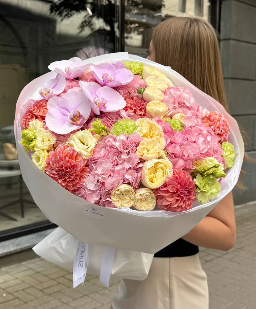 A lush bouquet in a soft pastel palette.