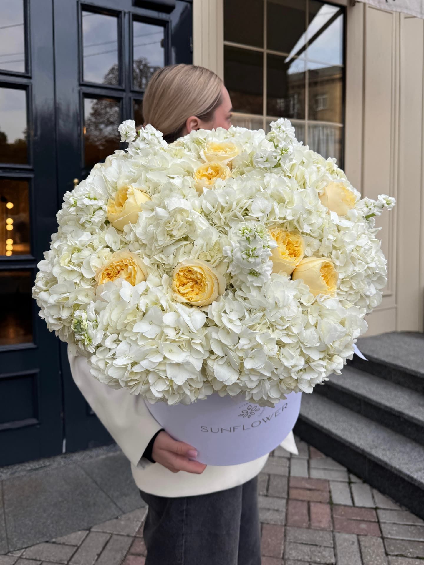 Large box with white hydrangea and yellow roses