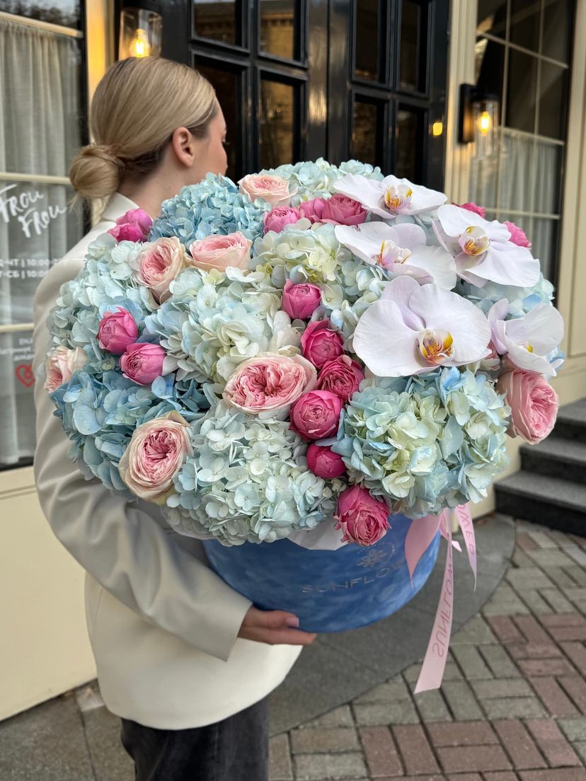 Designer arrangement with blue hydrangea and pink roses
