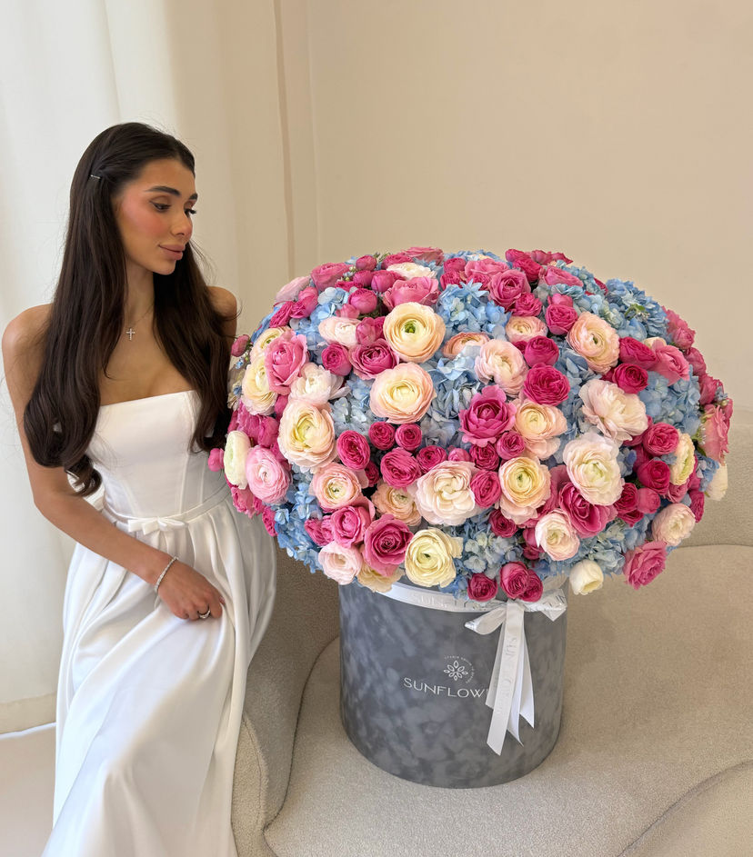 Box M of bush roses and blue hydrangeas