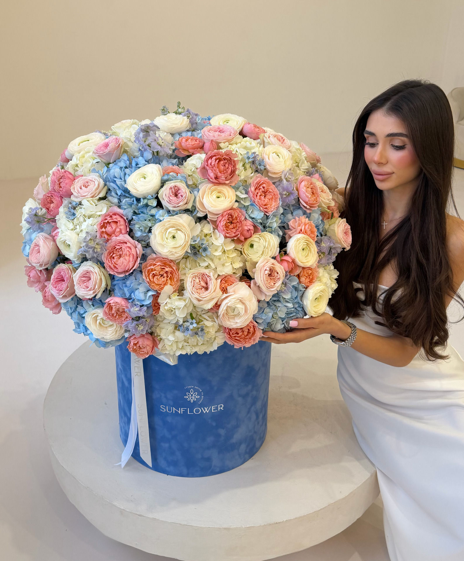 Box M of bush roses and ranunculus