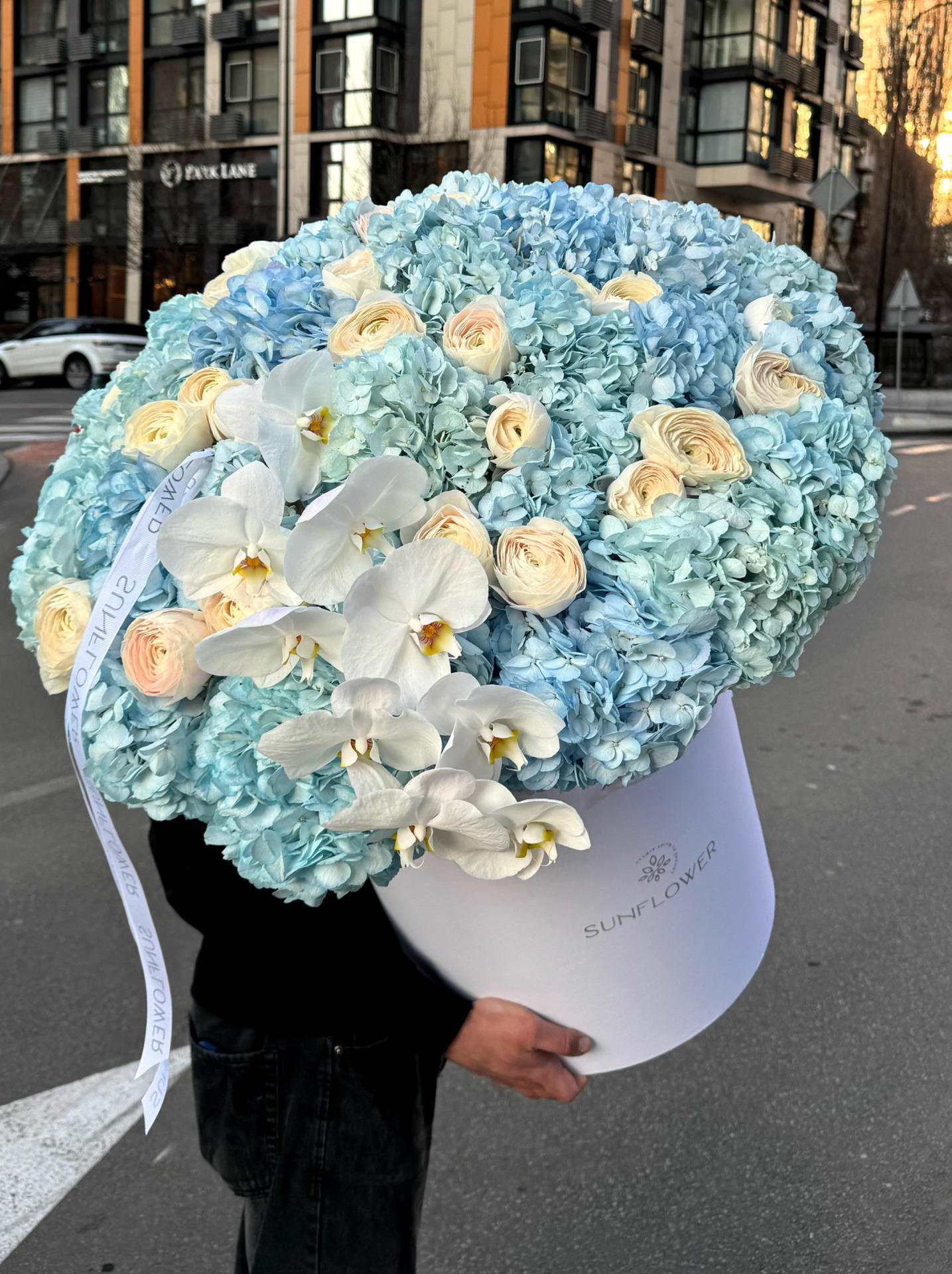 Box M in pastel blue shades with ranunculus