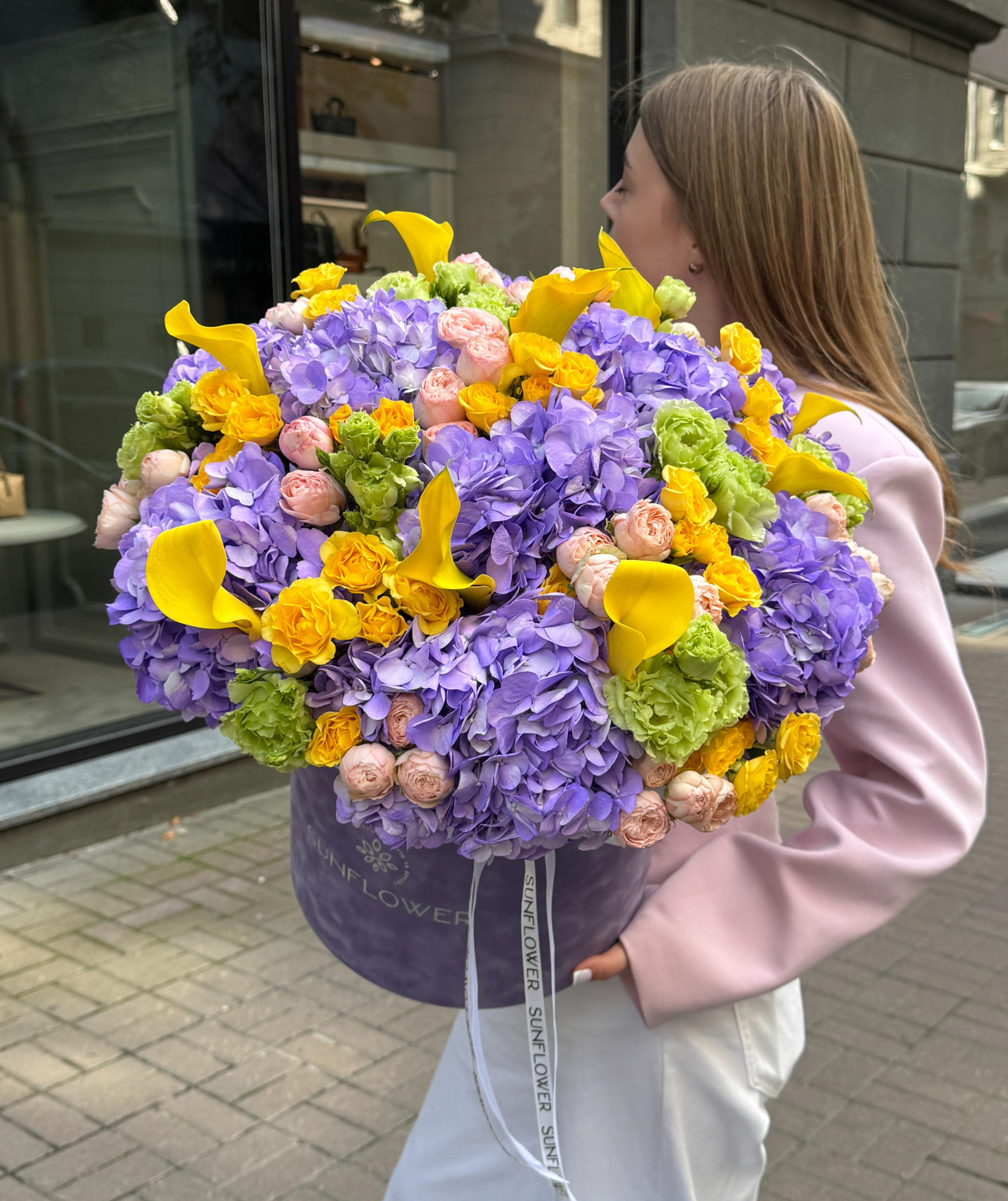 A composite composition with purple hydrangeas and yellow callas