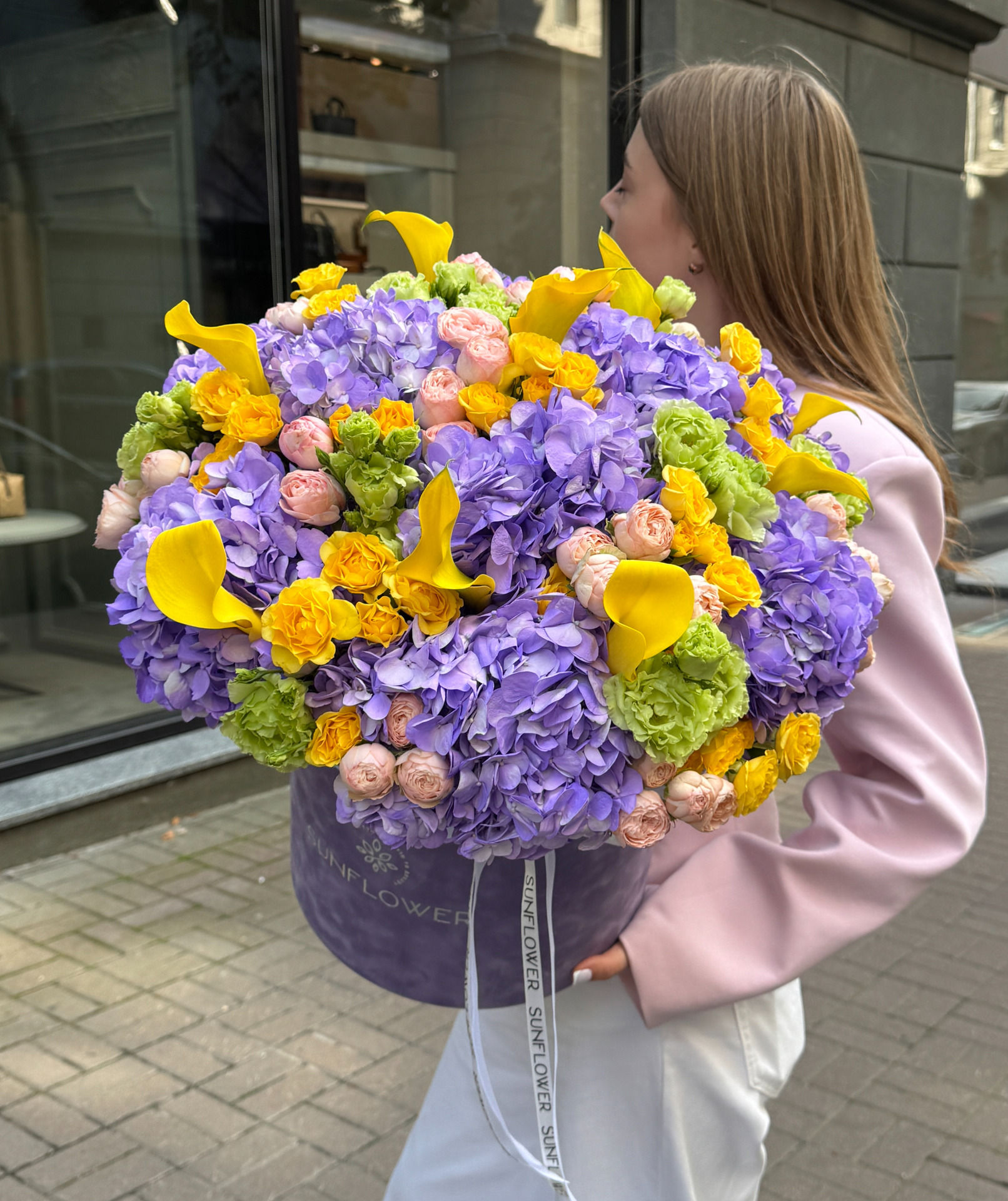 A composite composition with purple hydrangeas and yellow callas