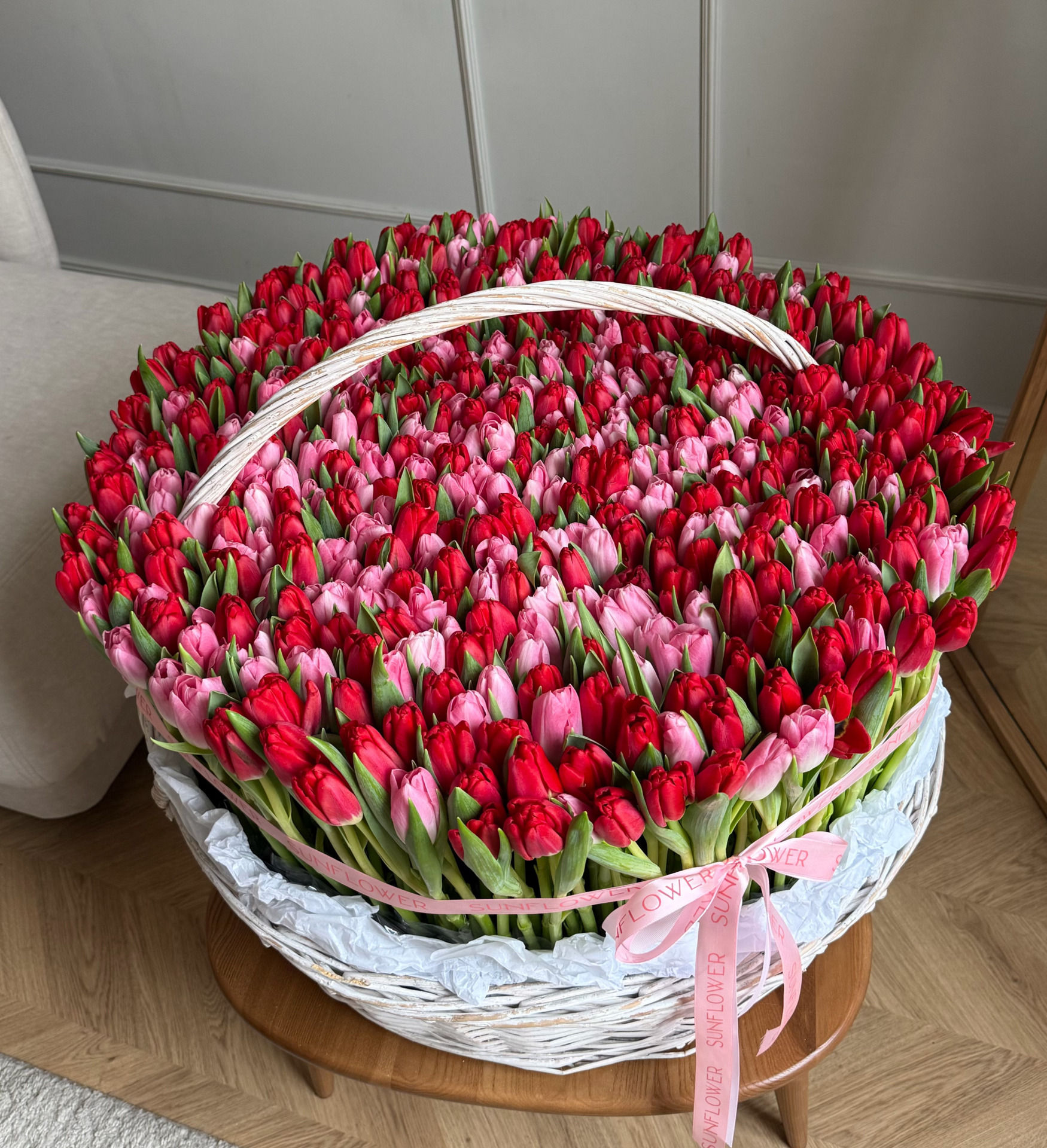XL basket with a mix of red and pink tulips