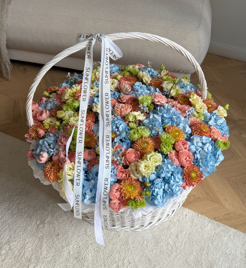 Flower Arrangement in XL Basket in orange tones