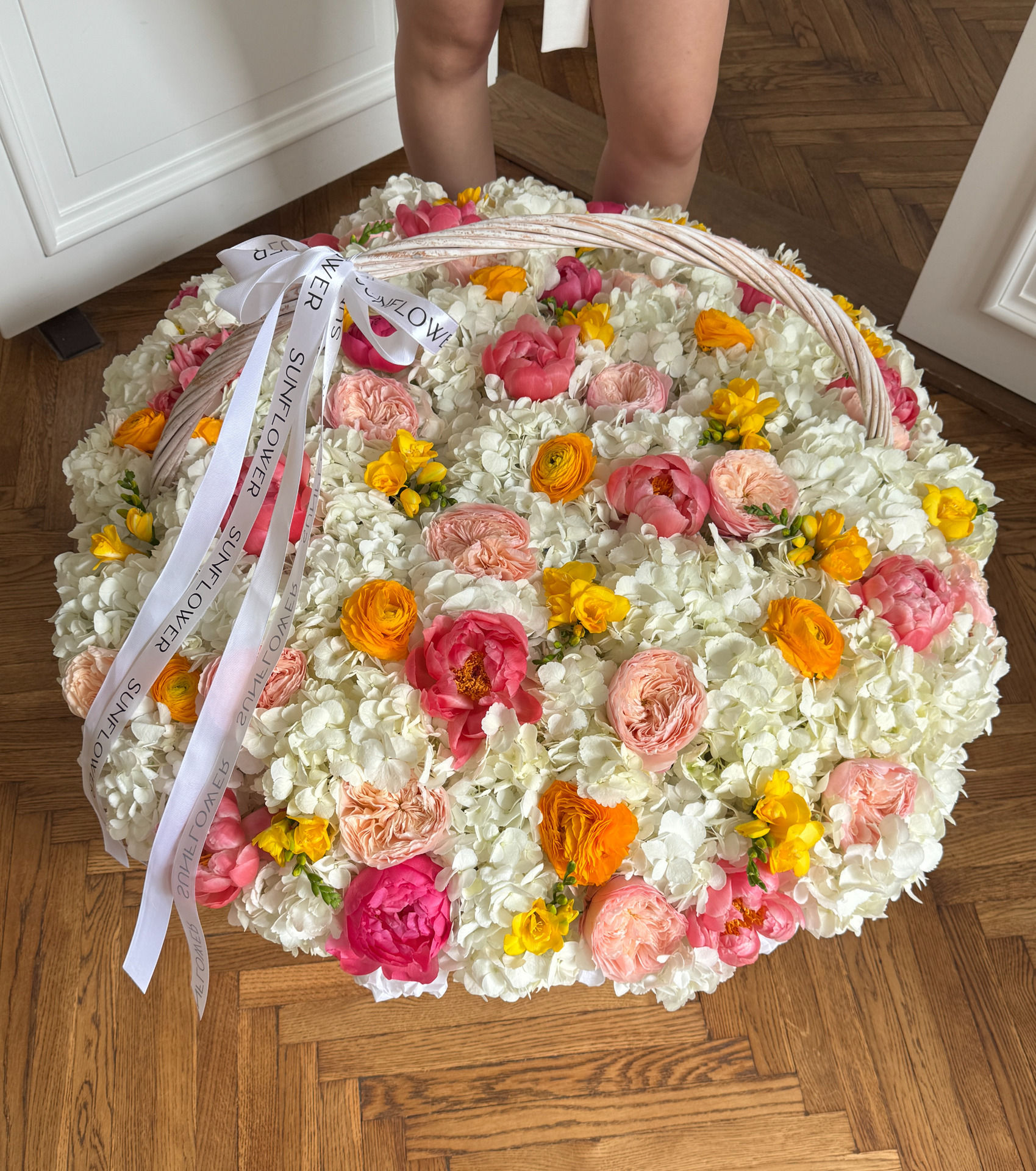 XL basket with white hydrangea and coral peonies