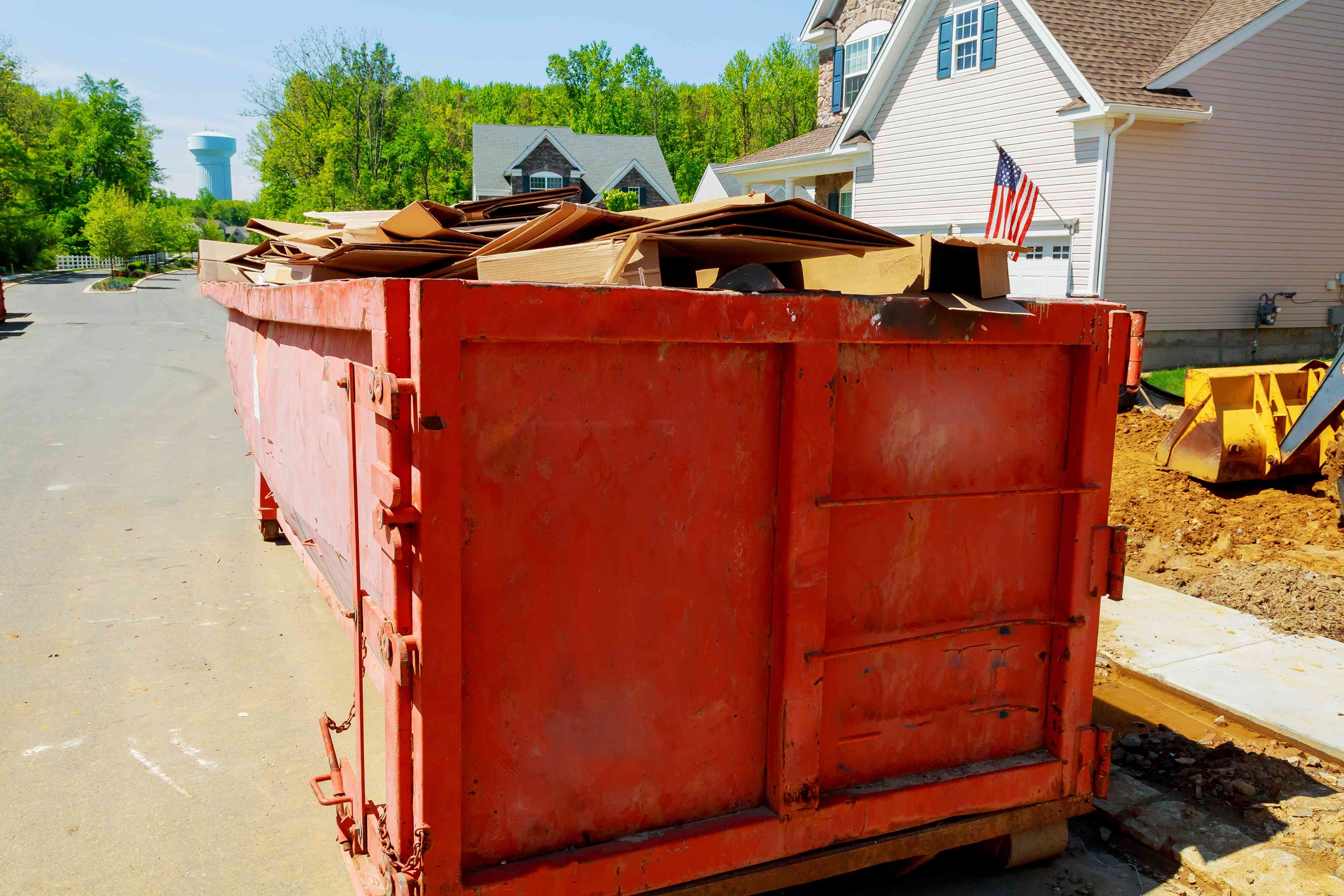 1746418227805-loaded-dumpster-near-a-construction-home-renovation_TC--8TJju