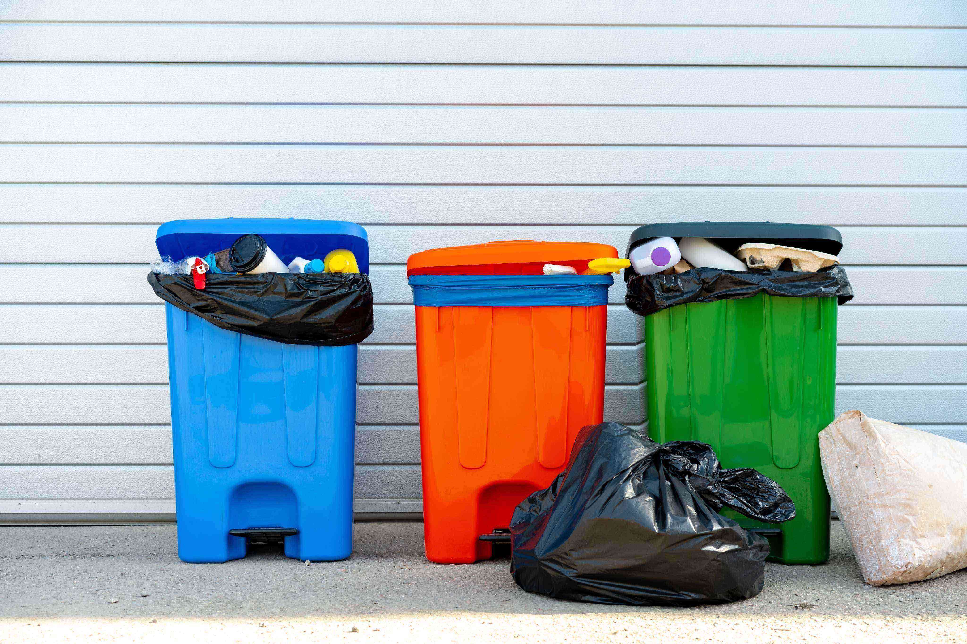 1747200916667-three-trash-containers-full-of-garbage-near-the-dumpster_zsh736DC2
