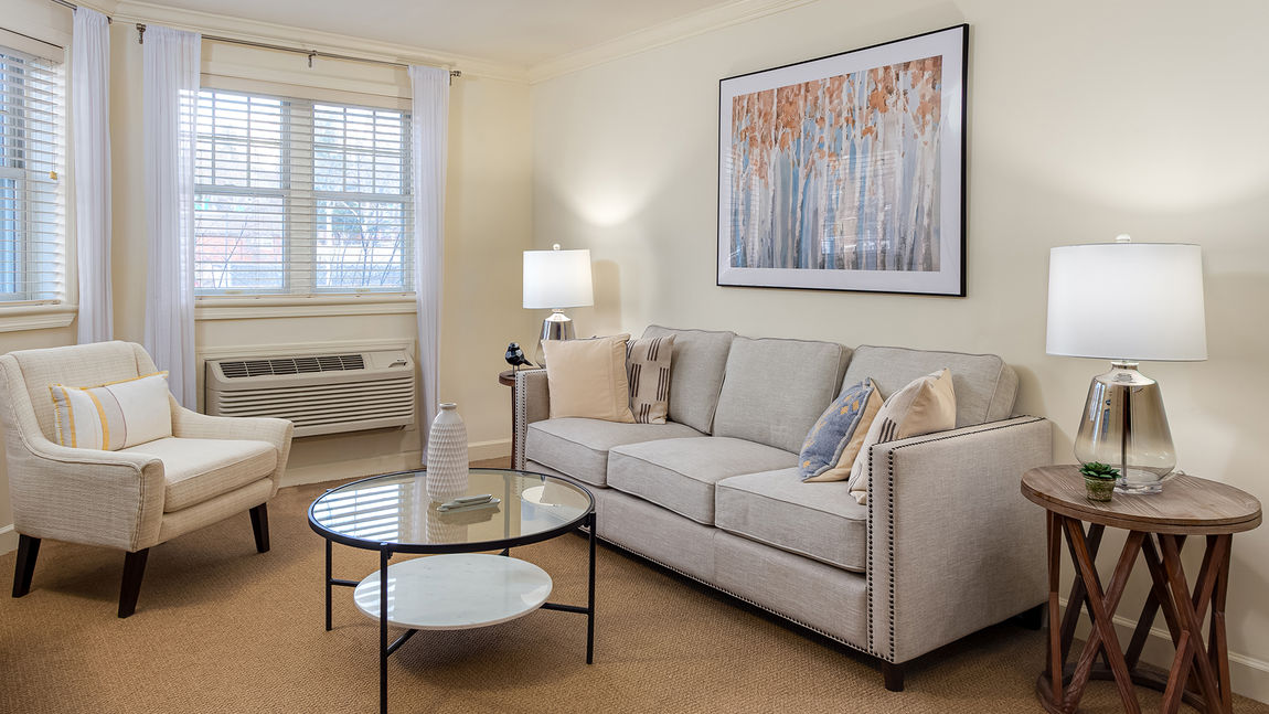 Apartment living room at Atria Glen Cove