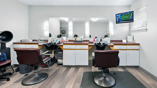 On-site salon with two hairwashing stations, a hair dryer and TV