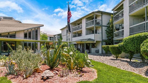 Holiday Montara Meadows exterior with cacti and American flag out front