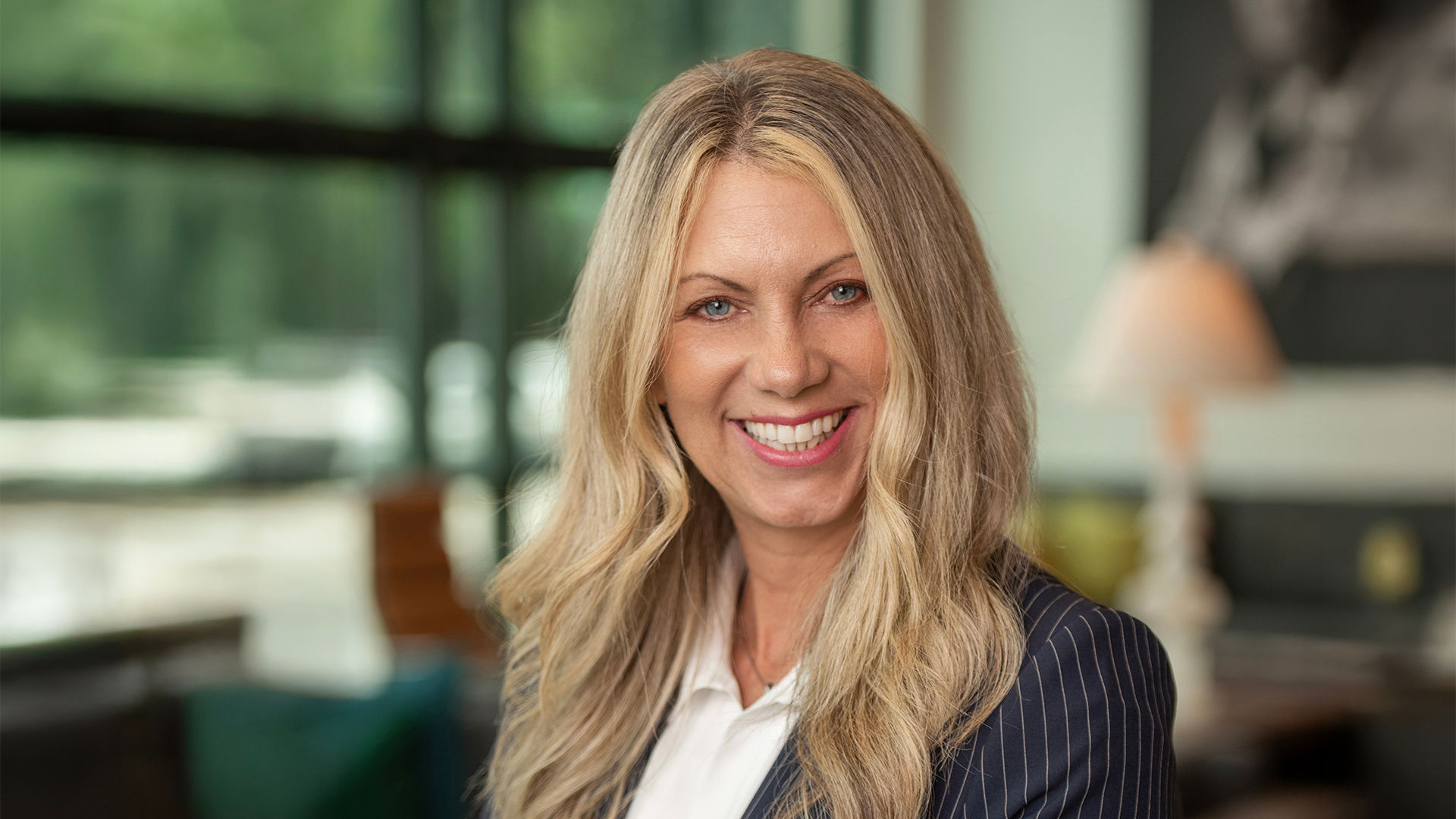 Smiling headshot of Nicole Evans, Divisional Sales Director at Atria Senior Living.