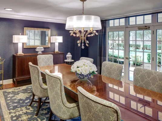 Darien Private Dining room with long dining table, chandelier and floor to ceiling window wall.