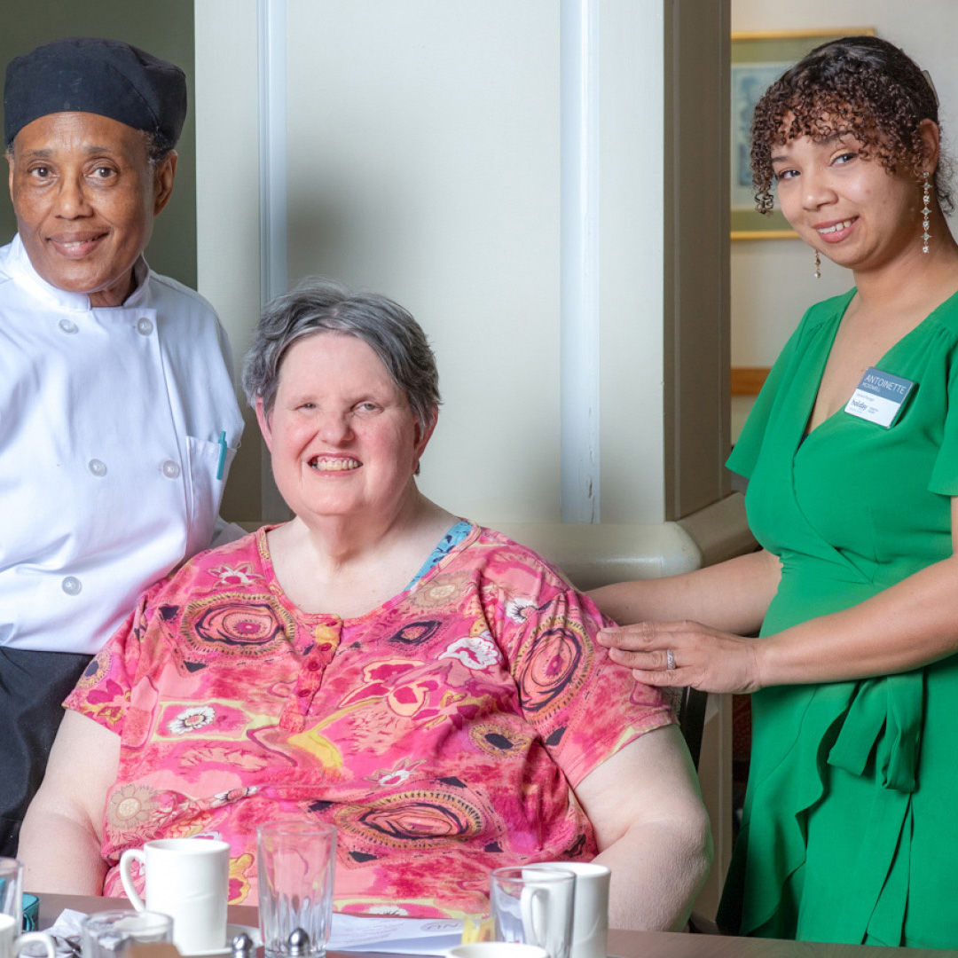 Holiday Forsyth Court staff photographed together in community lobby
