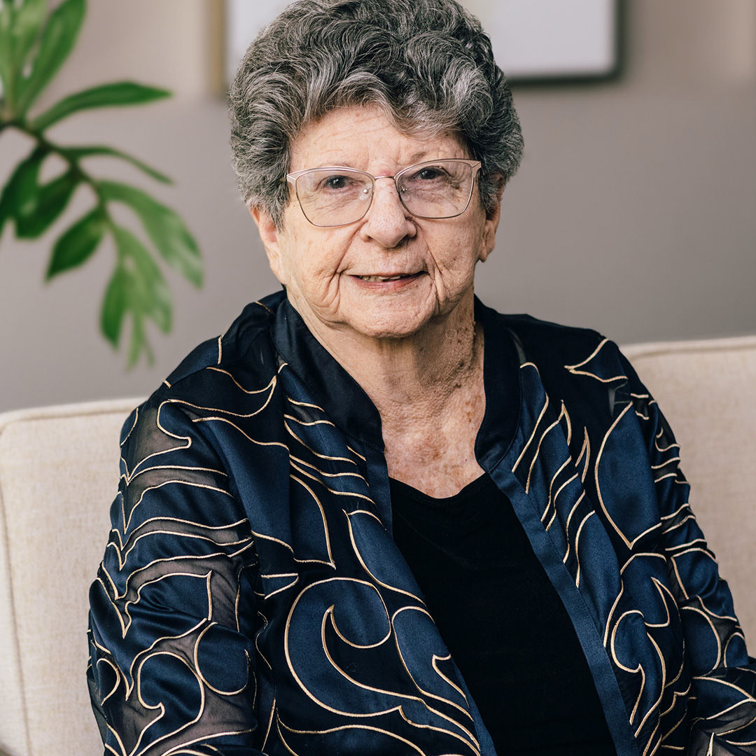 Holiday resident Miriam photographed on the couch in the community living room