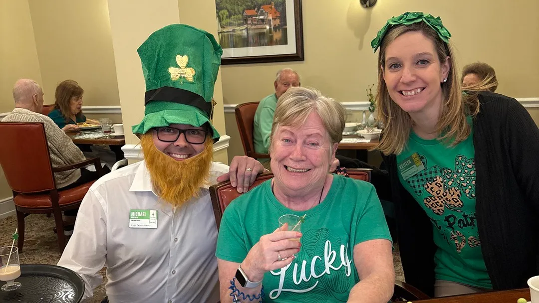 Residents and staff enjoying a St Pattrick's Day lunch while dressing up for the occasion