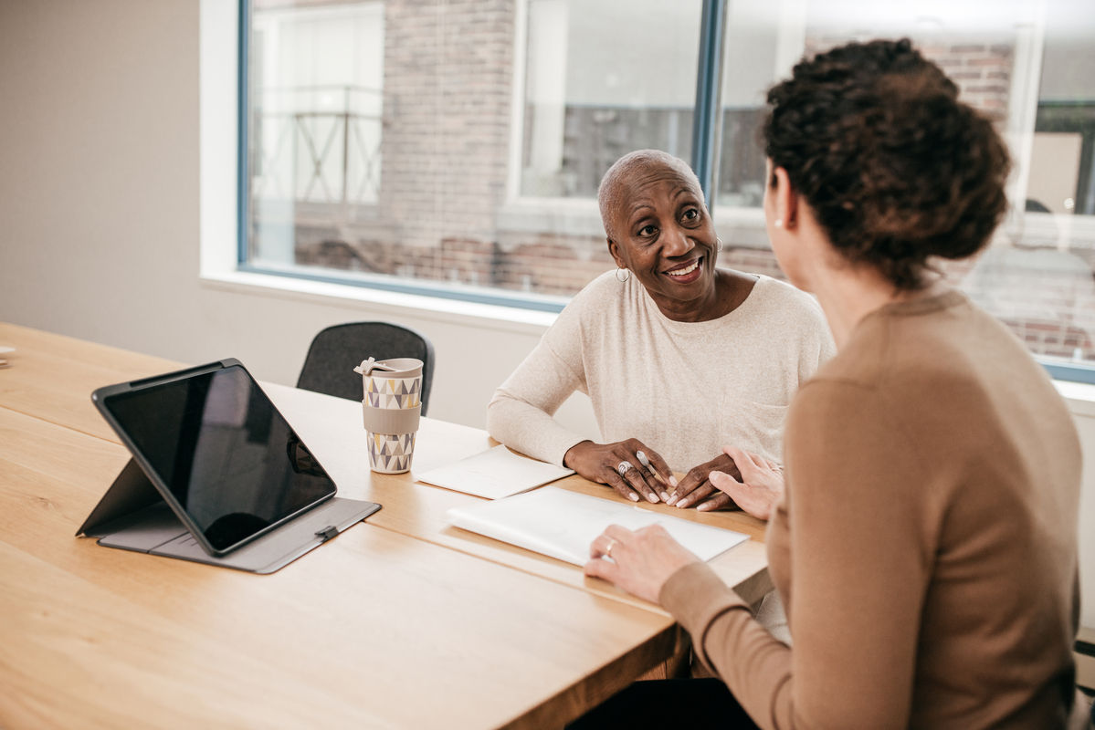 Older woman meeting with a female financial advisor