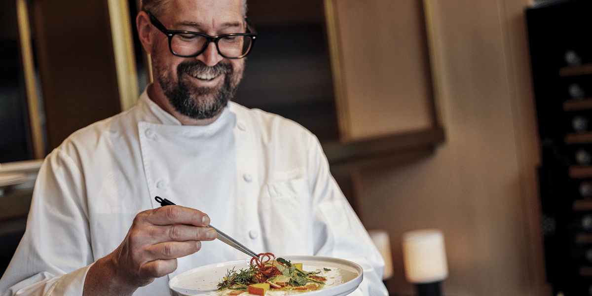 Chef Chad Welch showcasing a plate of food