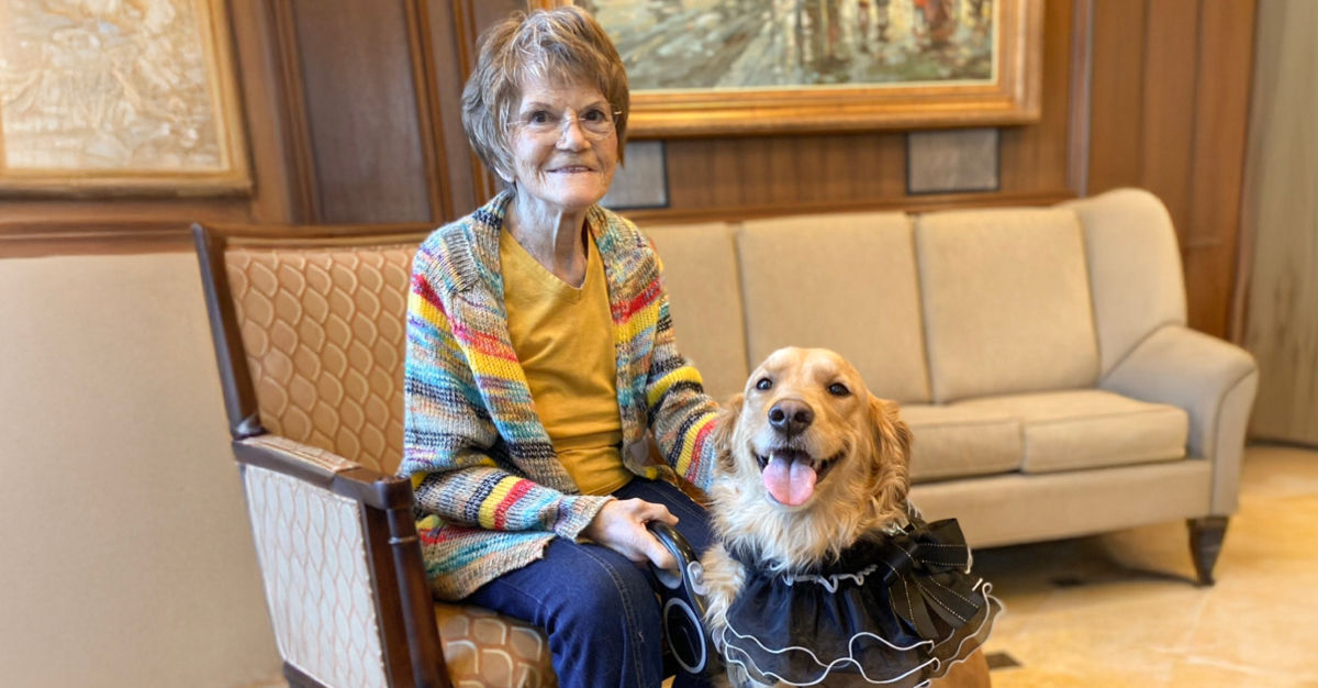 Ruthetta, a resident at Atria Forest Hills, photographed with her dog, Mitzy.