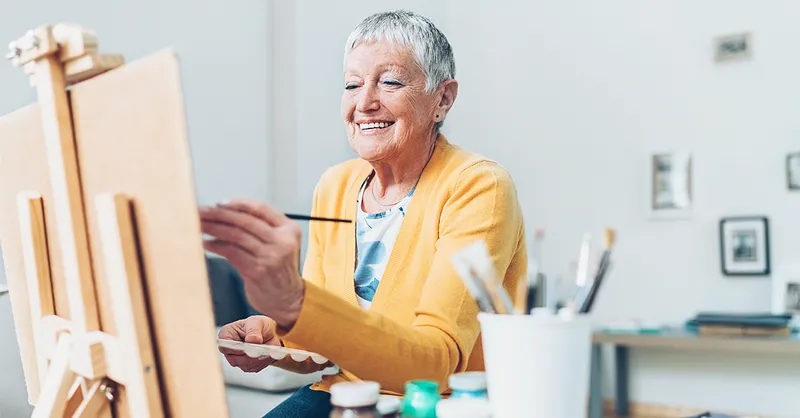 Senior woman painting