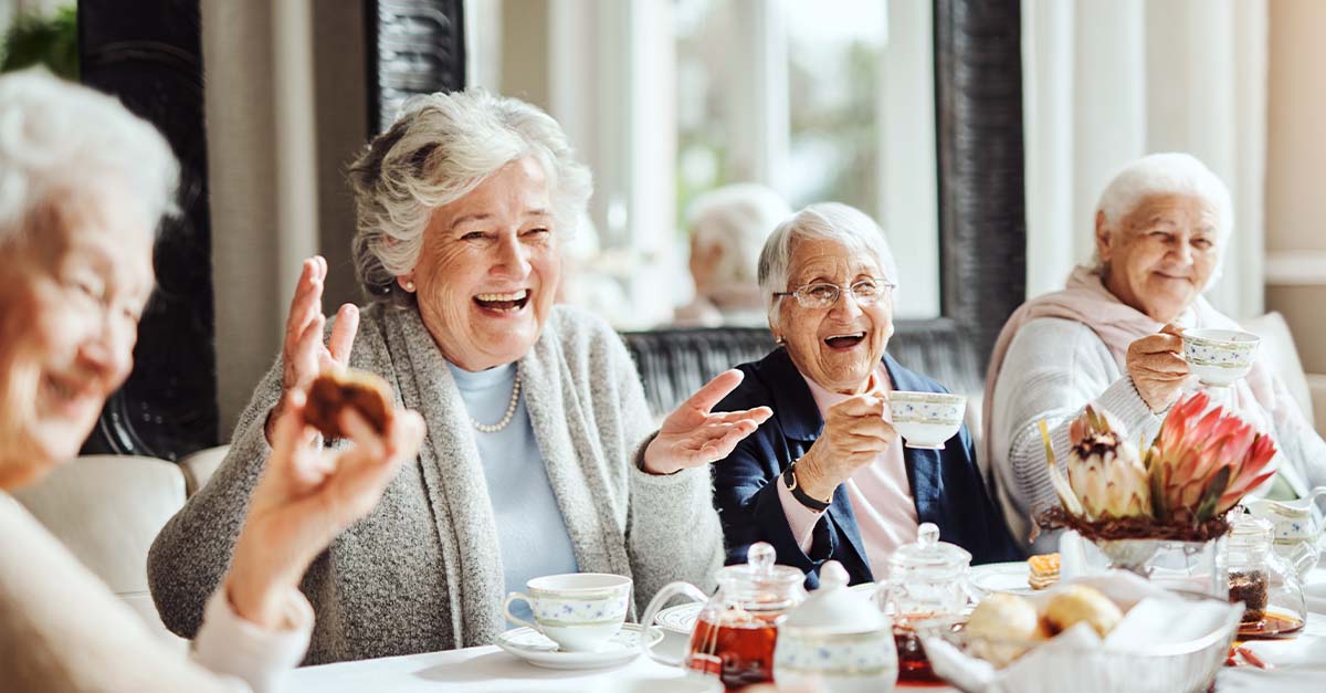 Group of seniors having breakfast together