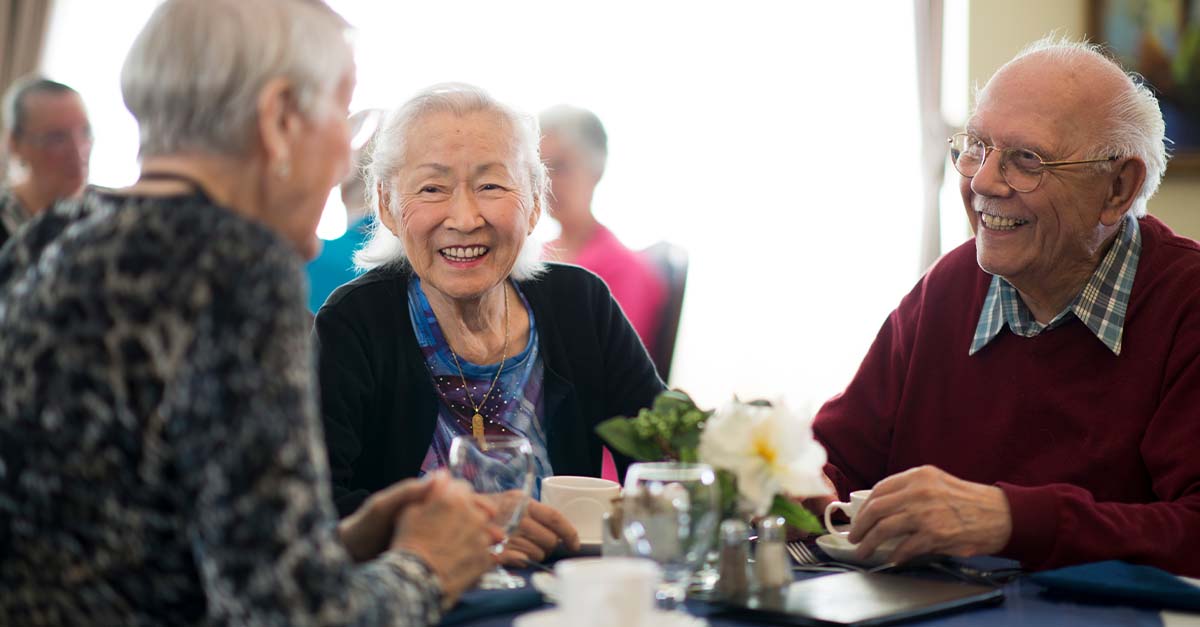 Three senior enjoying a meal together