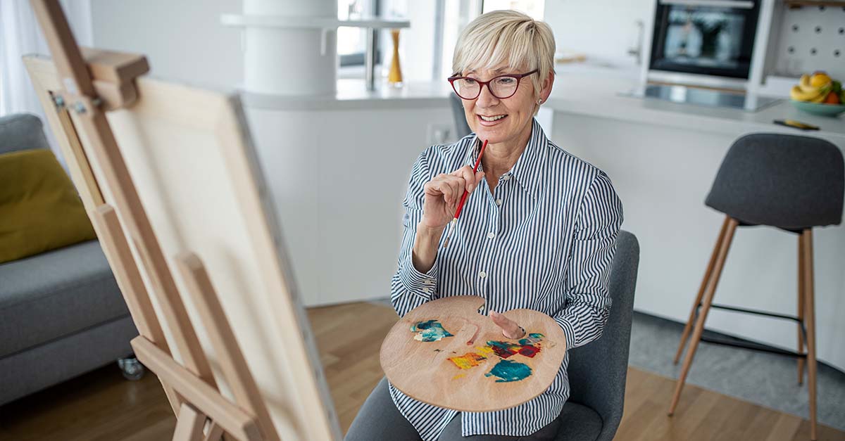 Older woman painting
