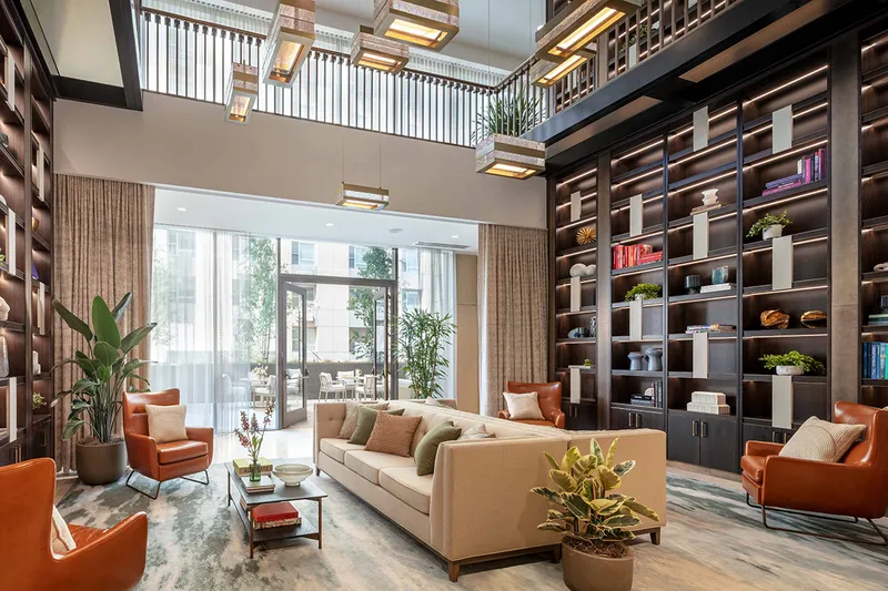 Luxury lounge at Coterie Cathedral Hill with floor to ceiling bookshelves and luxury seating