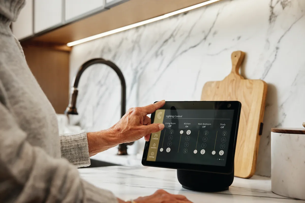 A resident uses their tablet to adjust their apartment's environment