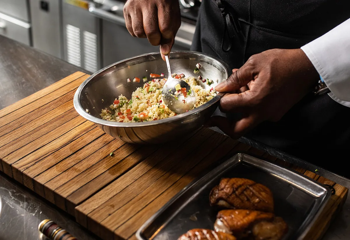 chef preparing quinoa salad