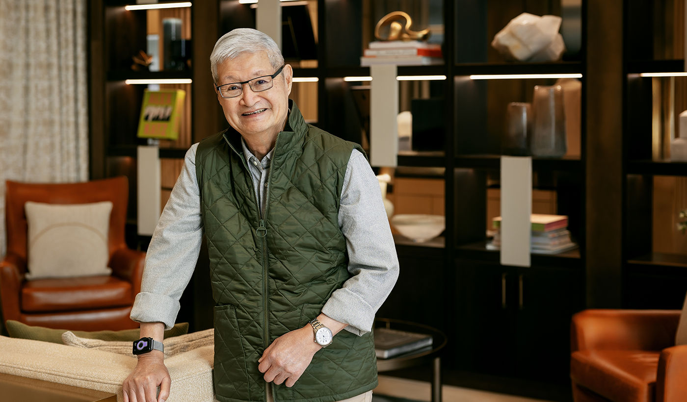 Coterie resident William Lee standing in community common space smiling.